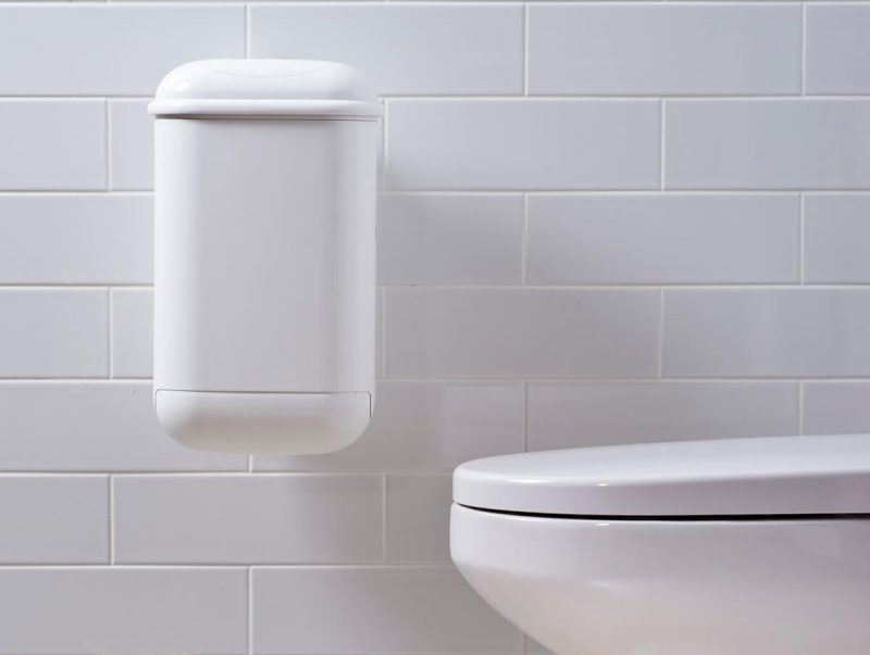 A white Pod Petite Auto unit on a white tiled wall