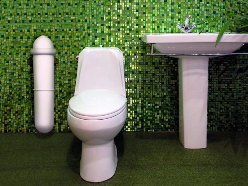 The white Pod Classic Auto in a green tiled washroom