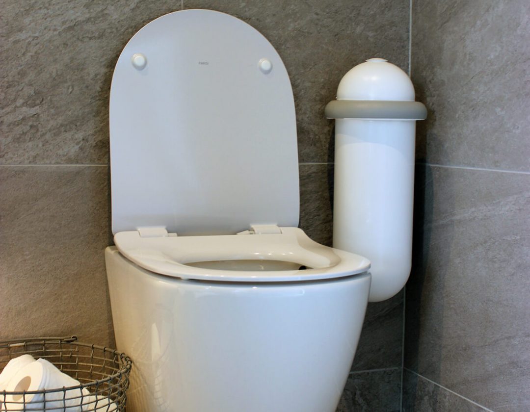The white Pod Classic Mini placed next to a toilet