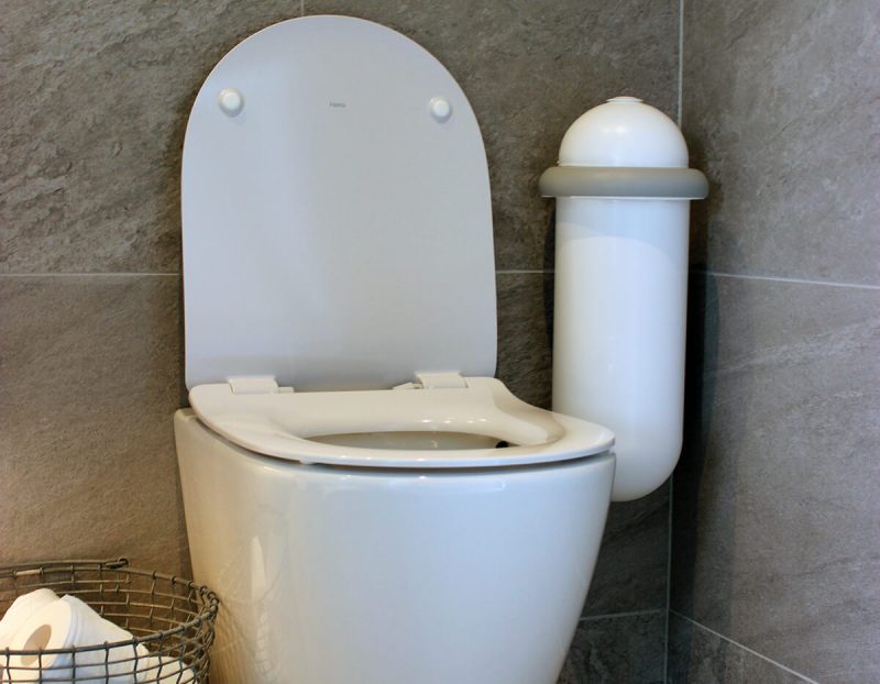 The white Pod Classic Mini placed next to a toilet