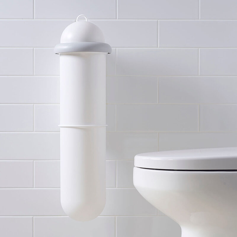 The Pod Classic Manual white sanitary unit installed on white tiled wall