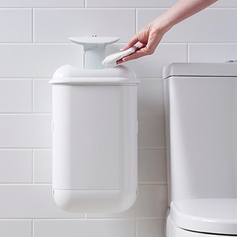 A person disposing of sanitary waste in Pod Petite Auto Touch-free hygienic automatic sanitary bin