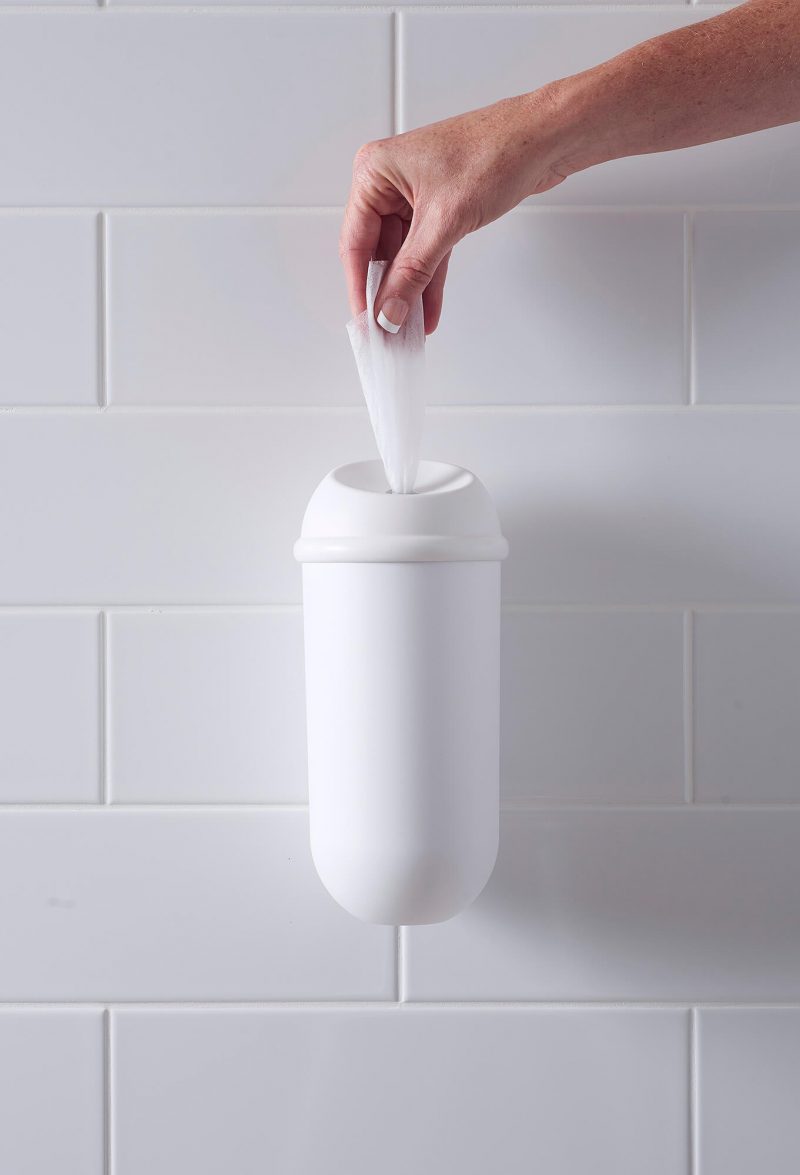 Wet Wipe White dispenser showing hand pulling out a antimicrobial wet wipe