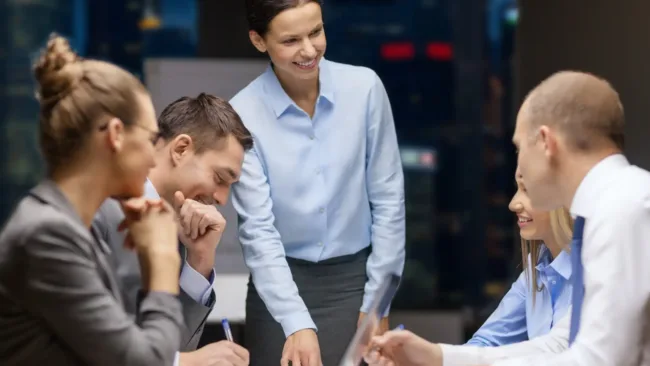 Image of men and women in a workplace meeting