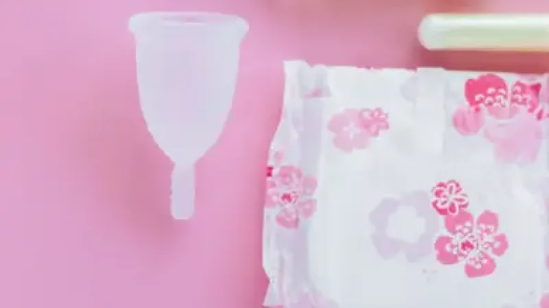 period equity - menstrual health products on pink background